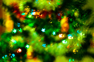 Fototapeta na wymiar Blured sparks of light on cristmas tree, spruce lights