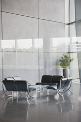 Chairs and table in office lobby area