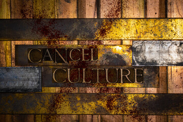 Photo of real authentic typeset letters forming text Cancel Culture on vintage textured silver...