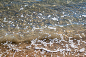 Fototapeta na wymiar sea foam at the beach