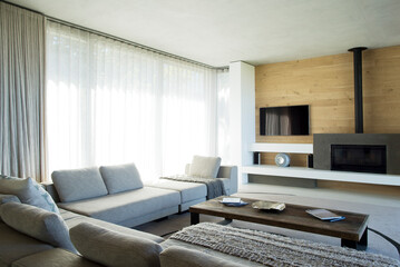 Fototapeta na wymiar Sofas and table in modern living room