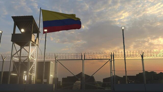 National flag of Colombia above military base at sunset