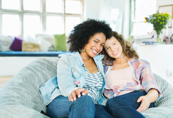 Women sitting in beanbag chair together