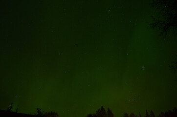 Fototapeta na wymiar majestic aurora borealis on autumn star filled night sky