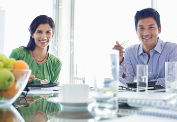 Business people smiling in meeting