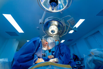 Surgical room in hospital with robotic technology equipment, machine arm surgeon in futuristic...
