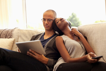 Fototapeta premium Couple relaxing together on sofa