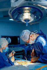 Surgeon operating with medical robotic surgery machine.  Modern automated medical device. Surgical...