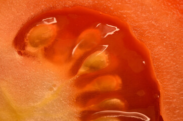 sliced tomato on kitchen table macro photo