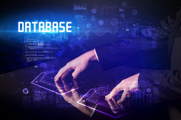 Hand touching digital table with DATABASE inscription, new age security concept