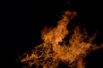 beautiful hot burning tall flames from bonfire on dark winter background