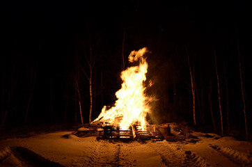 massive wood fire in winter night
