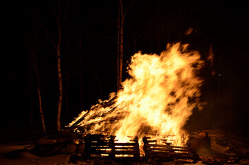 massive wood fire in winter night