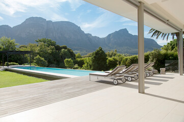 Fototapeta na wymiar Luxury swimming pool with mountain view