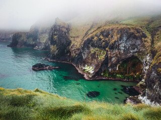 Cliff in a foggy day