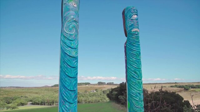 Maori carvings in Maitai Bay on the Karikari Peninsula. Northland, New Zealand