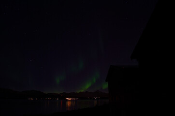 majestic strong aurora borealis on autumn star filled night sky