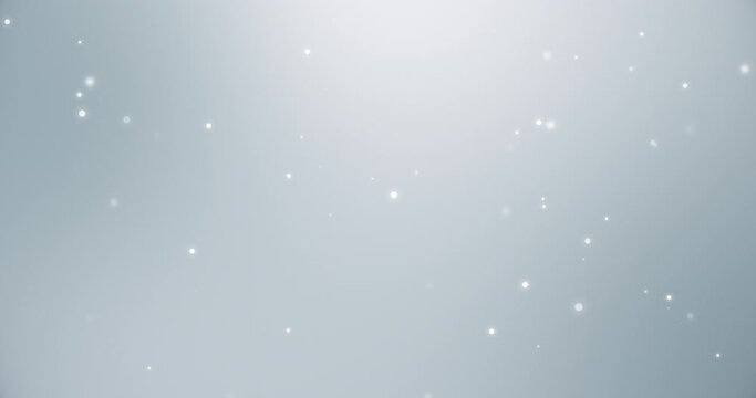 Seamless loop - abstract white particles floating on clean gray background. Focused on some particles. Rendered with a depth of field. Computer animation.