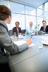 Smiling business people meeting in conference room