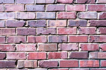 An old brick wall in bright sunlight
