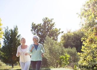 Senior women jogging in park