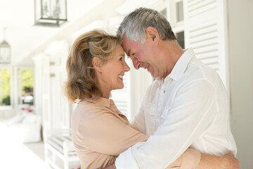 Fototapeta premium Senior couple hugging on patio