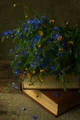 books with flowers close up in vintage style