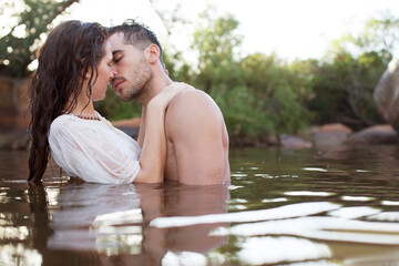 Couple kissing in river