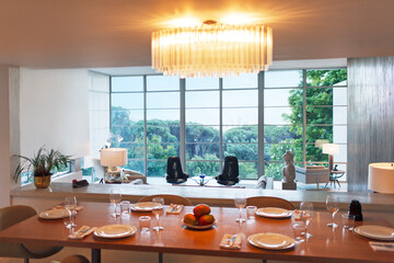 Place settings on table of modern dining room