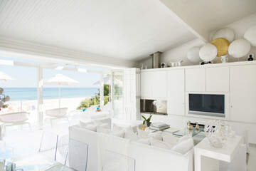 Modern living room overlooking beach and ocean