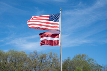 American and Latvian flags