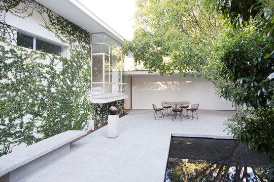 Table and chairs in modern courtyard