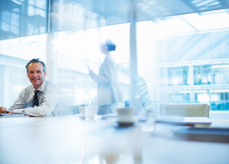Fototapeta premium Businessman sitting in conference room