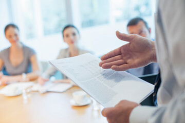 Businessman leading meeting in conference room