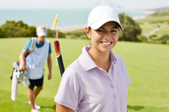 Smiling woman on golf course