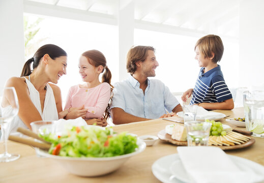 Family Eating Together At Table