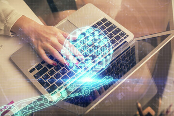 Double exposure of woman hands typing on computer and crypto market theme hologram drawing. Blockchain concept.