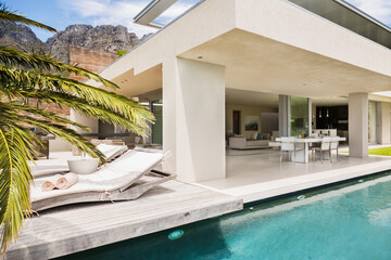 Swimming pool and patio of modern house - obrazy, fototapety, plakaty