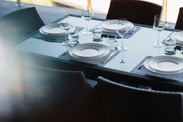 Fototapeta na wymiar Set table in modern dining room
