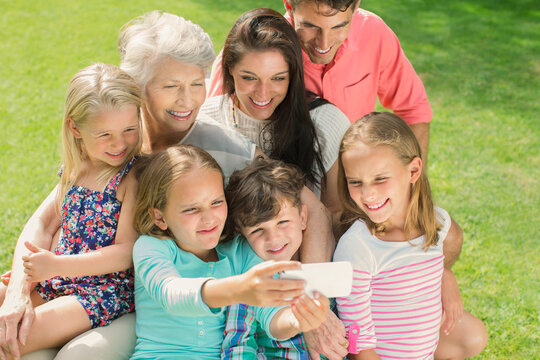 Family taking picture together with cell phone