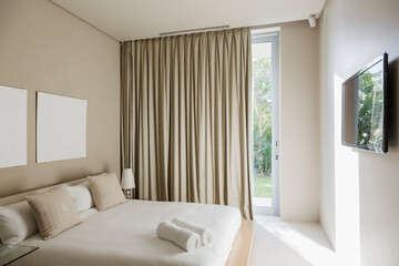 Curtains and bed in modern bedroom