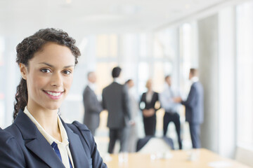 Businesswoman smiling in meeting