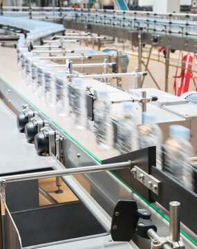 Bottles On Conveyor Belt In Factory