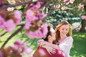 Couple hugging outdoors