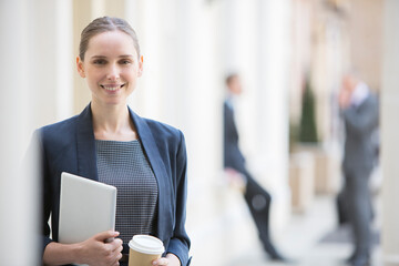 Businesswoman holding digital tablet