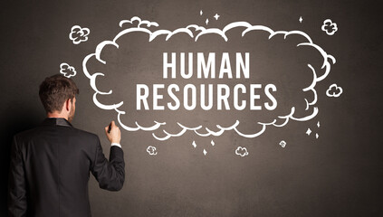 businessman drawing a cloud with HUMAN RESOURCES inscription inside, modern business concept