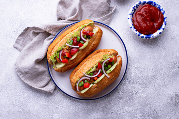 Hot dogs with sausage, sauces and vegetables
