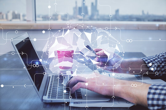 Double exposure of man hands typing on computer with credit card and brain theme drawing. E-commerce and AI concept.