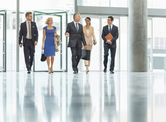 Business people walking in office