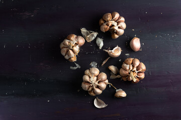 Garlic on a rustic wooden table. Top view